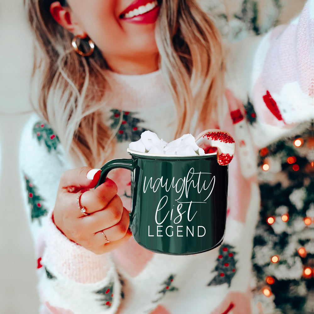 A vibrant red and green Naughty Legend Mug with white lettering, designed for holiday festivities, showcasing a playful naughty list theme.