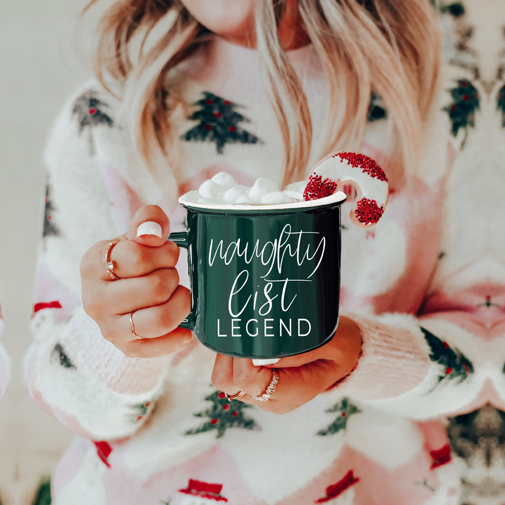 A vibrant red and green Naughty Legend Mug with white lettering, designed for holiday festivities, showcasing a playful naughty list theme.