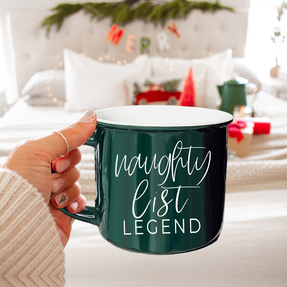 A vibrant red and green Naughty Legend Mug with white lettering, designed for holiday festivities, showcasing a playful naughty list theme.