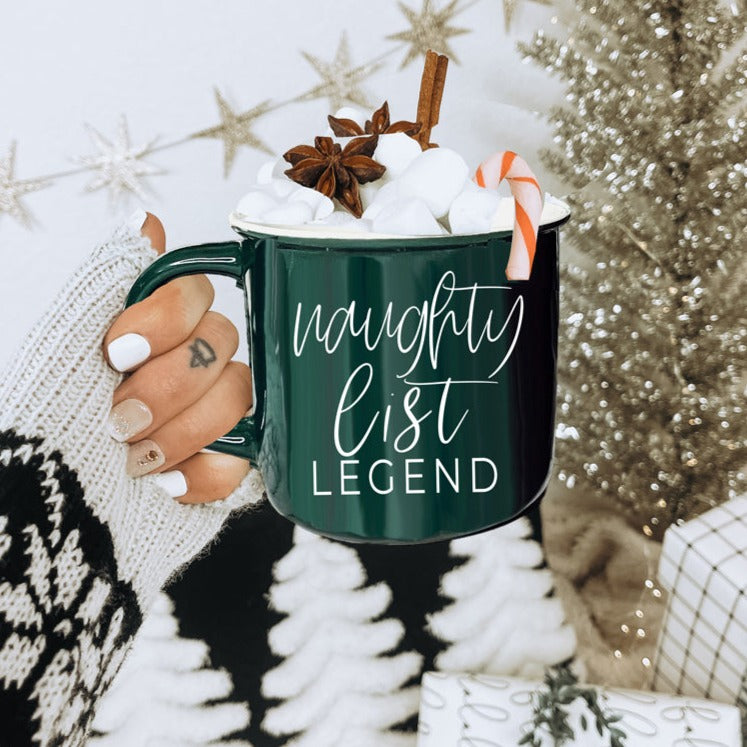 A vibrant red and green Naughty Legend Mug with white lettering, designed for holiday festivities, showcasing a playful naughty list theme.