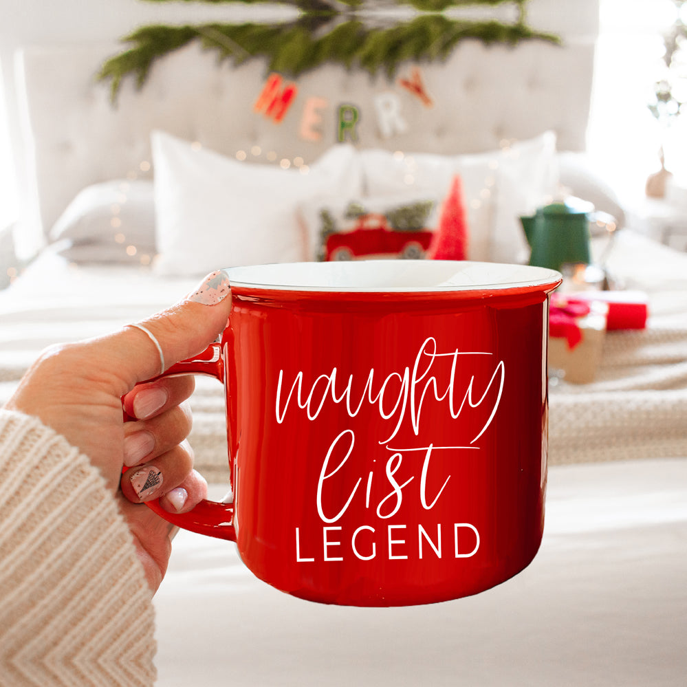 A vibrant red and green Naughty Legend Mug with white lettering, designed for holiday festivities, showcasing a playful naughty list theme.