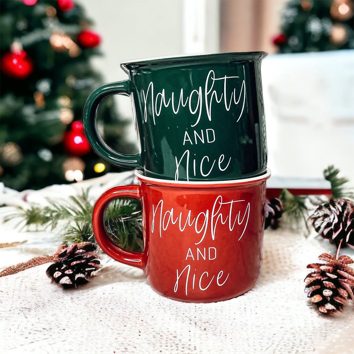 A vibrant Naughty & Nice Mug in red and green ceramic, featuring playful white lettering on both sides, perfect for coffee lovers.