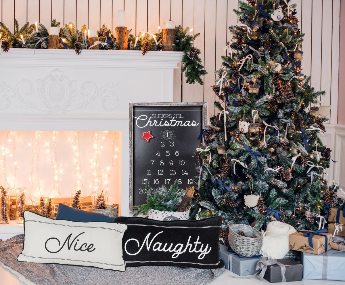 A reversible Naughty or Nice pillow featuring black and white colors, displaying 'Naughty' on one side and 'Nice' on the other, perfect for Christmas decor.