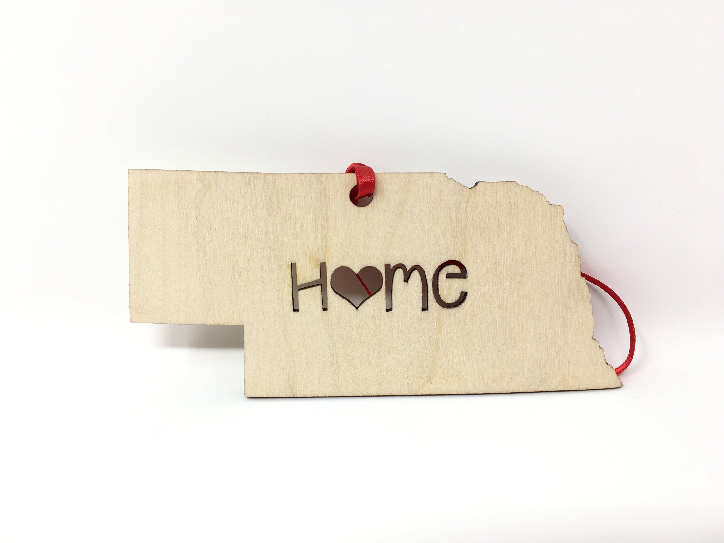 Nebraska State Wood Christmas Ornament made from Baltic Birch, featuring a 'Home' design, perfect for holiday decor.