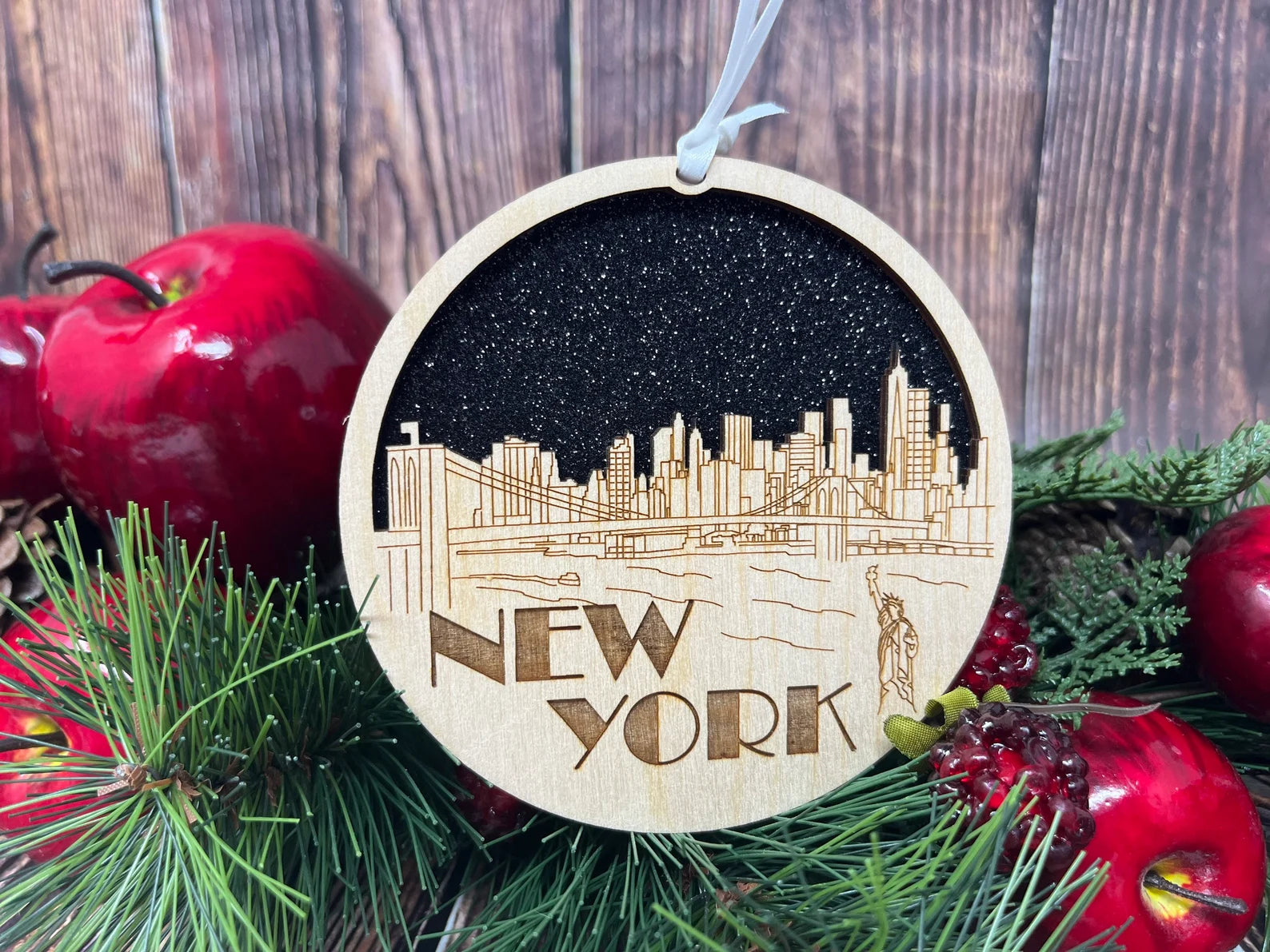 New York Skyline Ornament made from premium Baltic birch wood, featuring intricate skyline design, perfect for holiday decor.