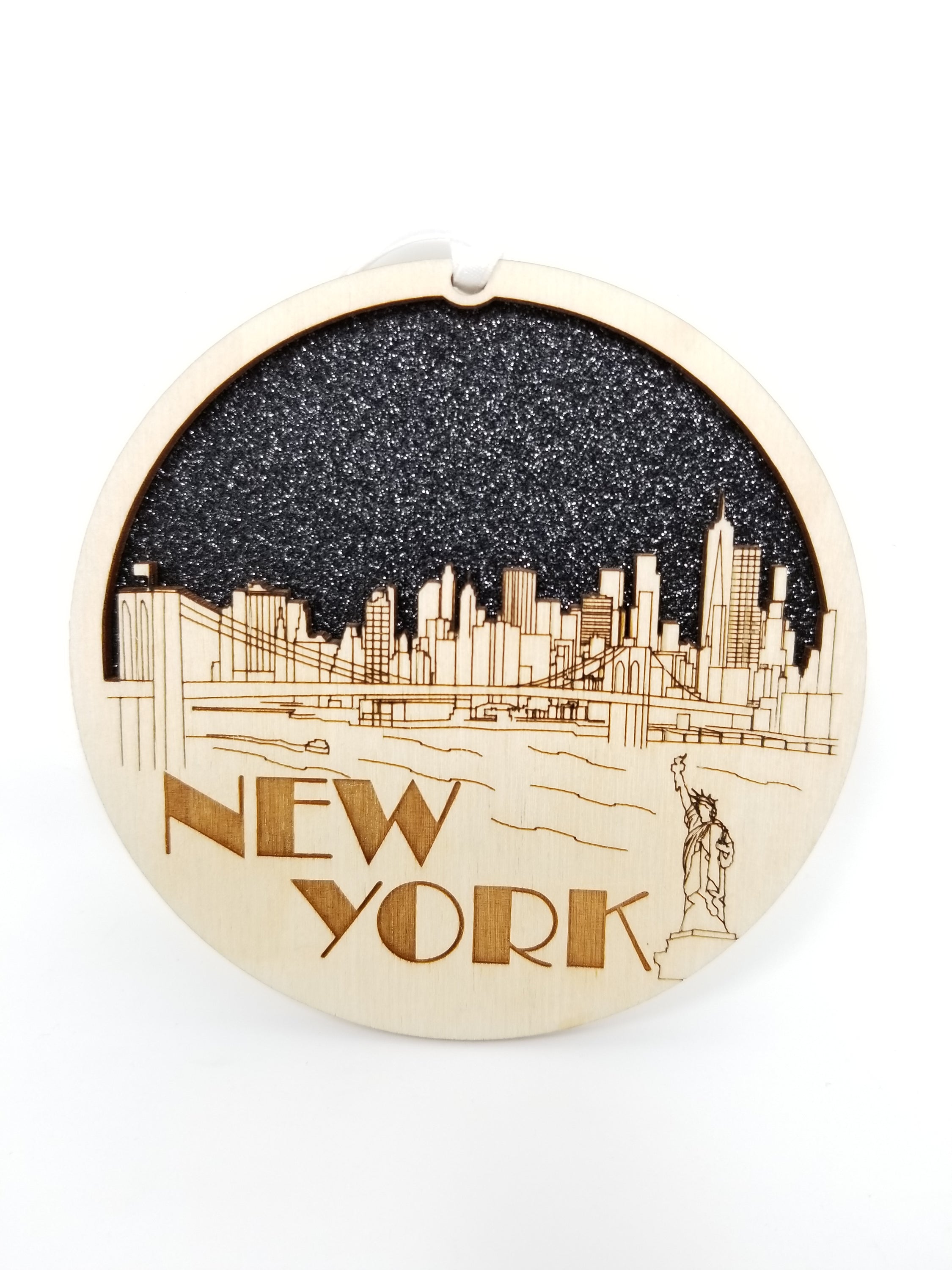 New York Skyline Ornament made from premium Baltic birch wood, featuring intricate skyline design, perfect for holiday decor.