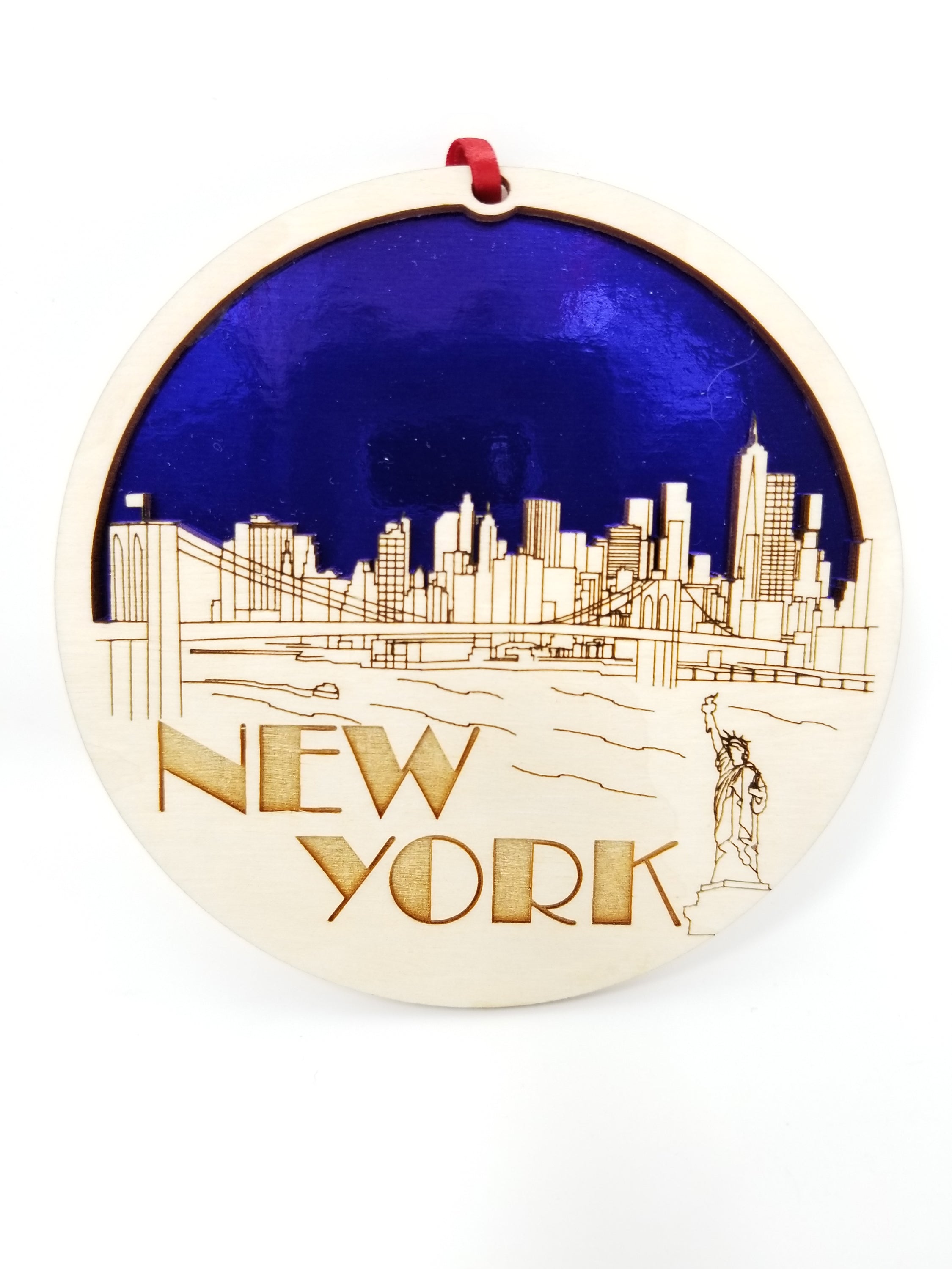 New York Skyline Ornament made from premium Baltic birch wood, featuring intricate skyline design, perfect for holiday decor.