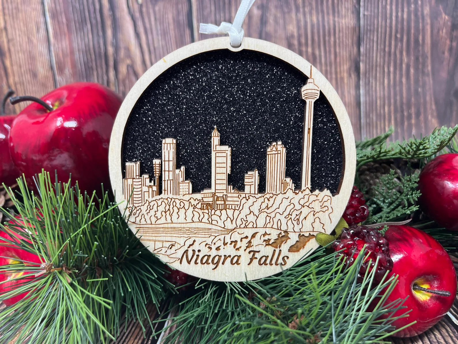 A beautifully crafted Niagara Falls skyline ornament made from premium Baltic birch wood, showcasing intricate details and a natural finish.