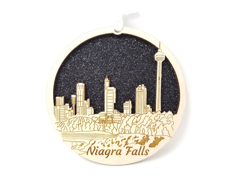 A beautifully crafted Niagara Falls skyline ornament made from premium Baltic birch wood, showcasing intricate details and a natural finish.