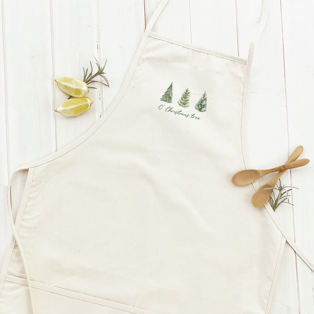 O' Christmas Tree Women's Apron featuring a festive design, made from durable cotton canvas with adjustable neck and natural twill ties.