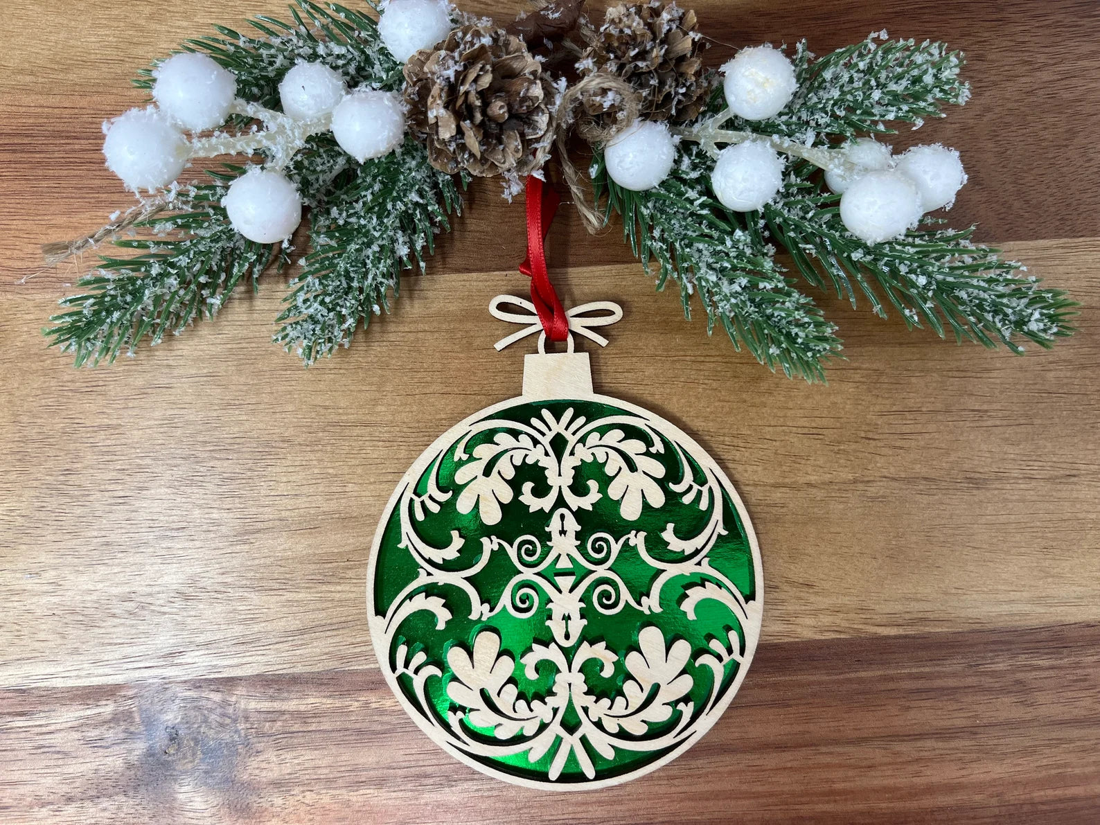 Ornate Ball laser cut wooden ornament made from premium Baltic Birch, featuring intricate designs and measuring 3.5x3 inches.