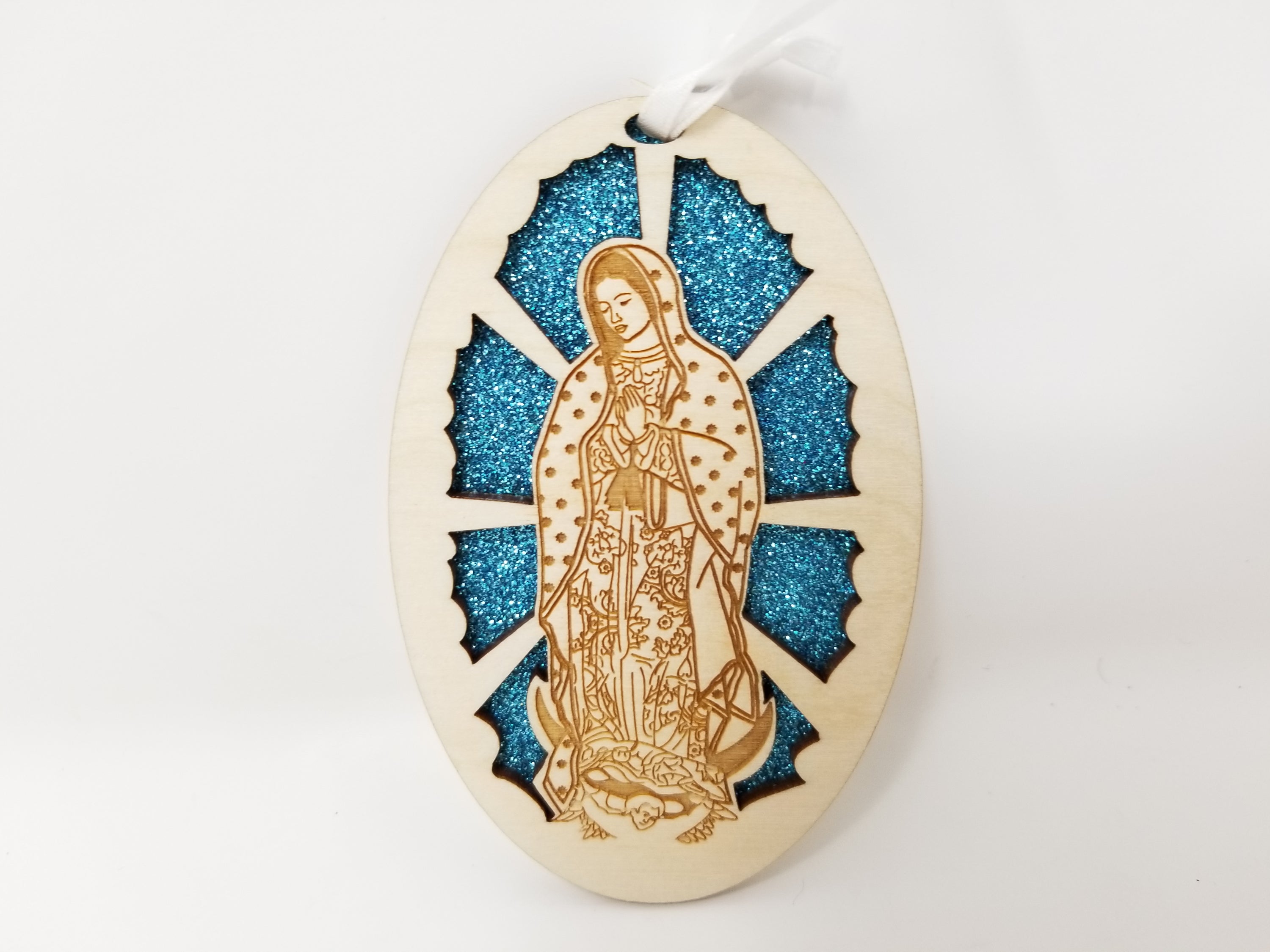 Our Lady of Guadalupe ornament made from premium Baltic Birch wood, intricately laser cut and assembled, perfect for holiday decoration.