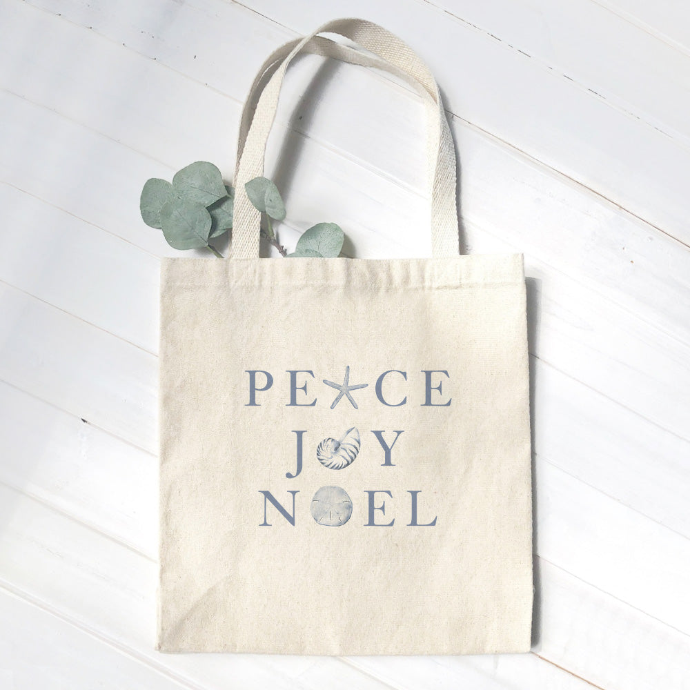 Peace Joy Noel Canvas Tote Bag featuring vibrant design and durable straps, perfect for eco-friendly shopping.