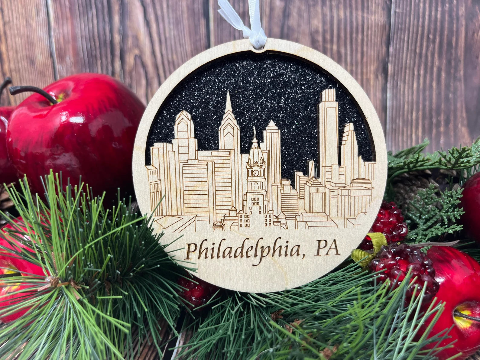 A beautifully crafted Philadelphia skyline ornament made from premium Baltic birch wood, showcasing intricate details of the city's skyline.