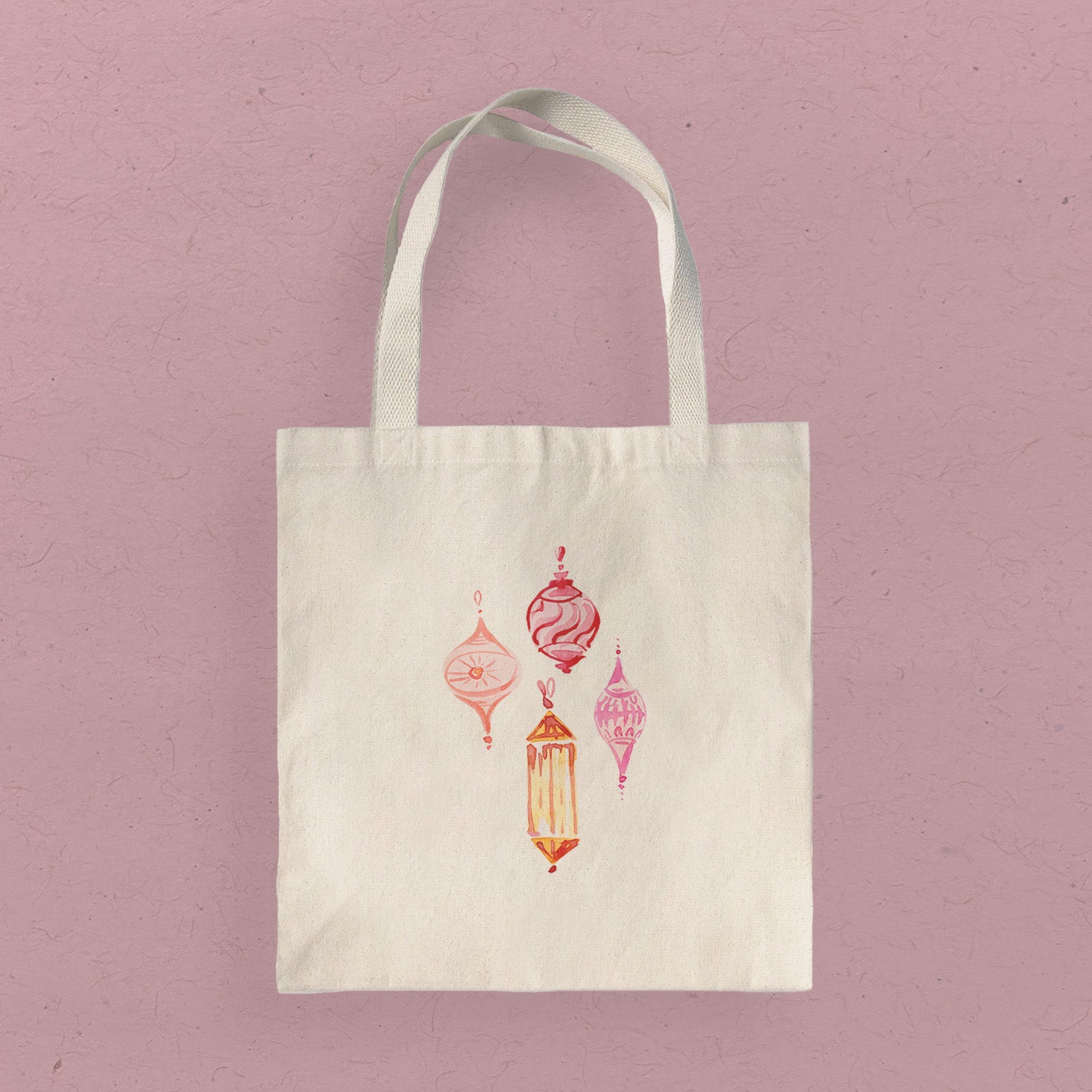 A stylish Pink Ornaments Canvas Tote Bag featuring a vibrant pink ornament design, made from durable heavy-duty canvas.