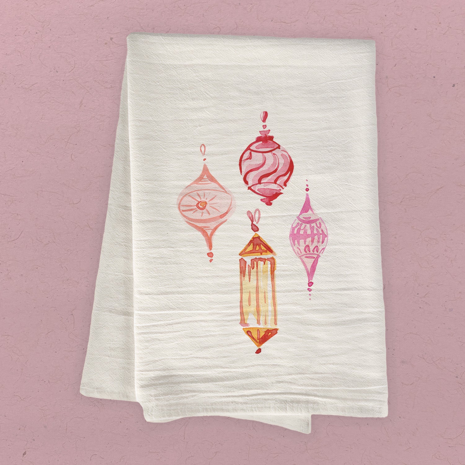 A vibrant pink ornaments cotton tea towel featuring a beautiful design, perfect for kitchen use.