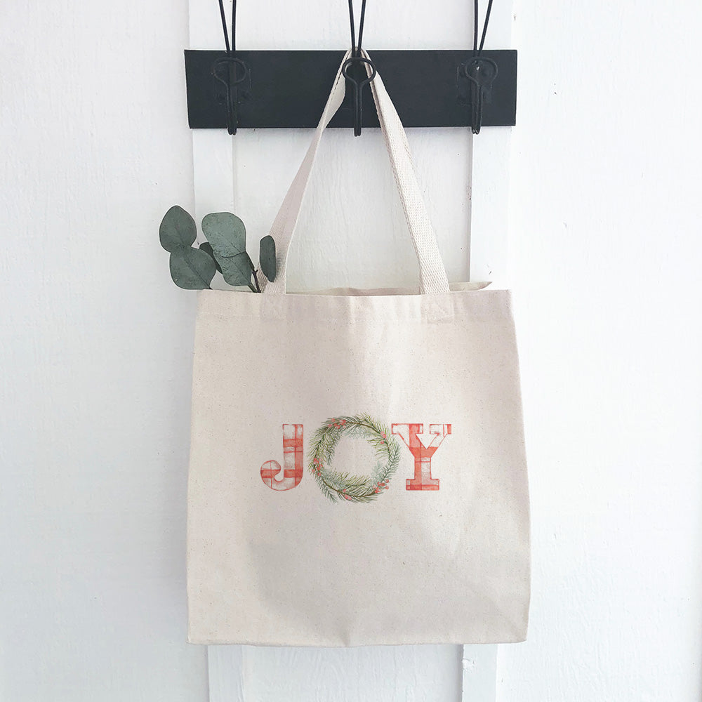 Plaid Joy Wreath Canvas Tote Bag featuring a vibrant plaid wreath design on durable fabric.