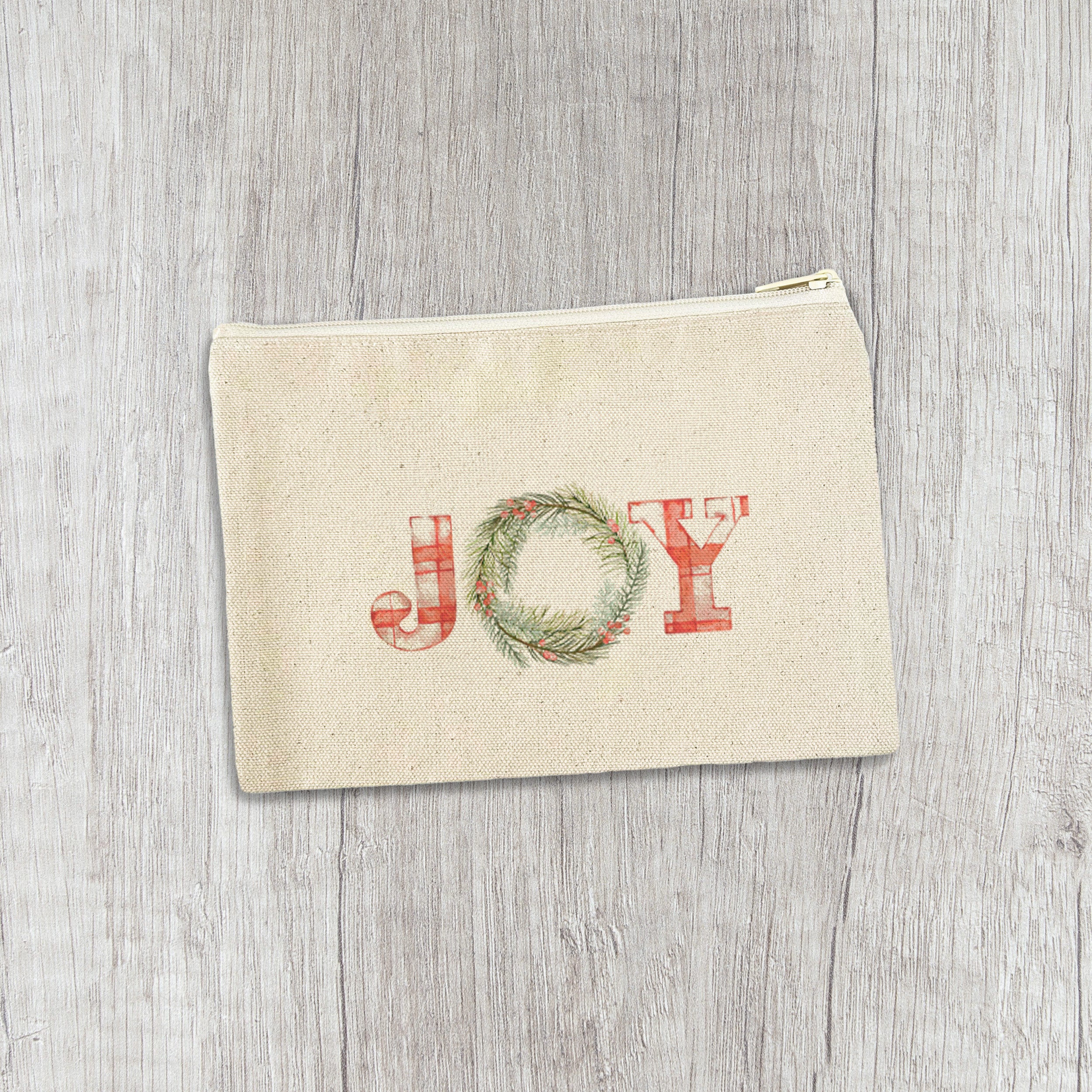 Plaid Joy Wreath Canvas Zipper Pouch featuring a charming plaid design and natural color zipper, perfect for organization.