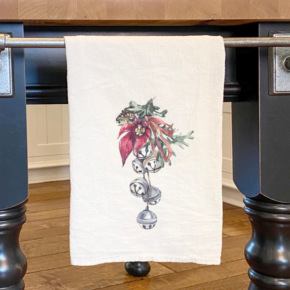 Poinsettia Bells Cotton Tea Towel featuring vibrant floral design on absorbent fabric.