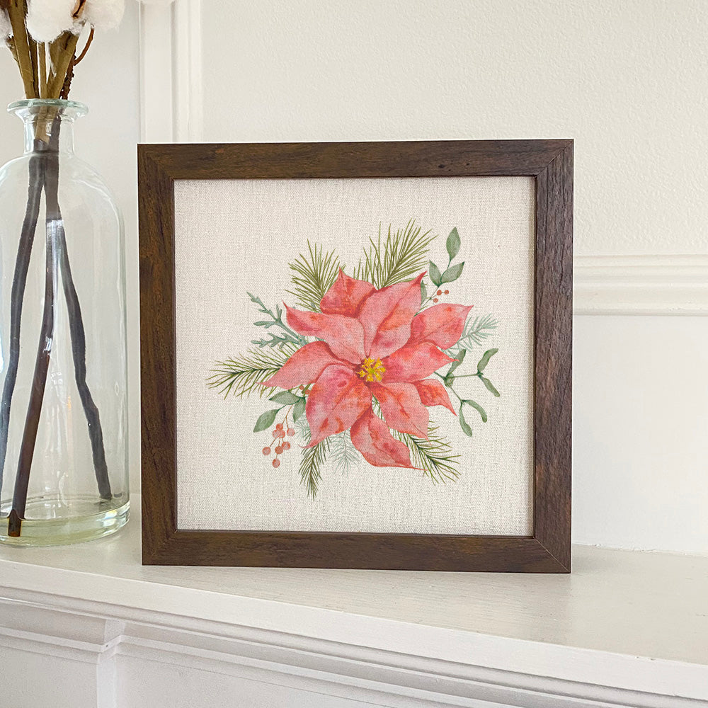 A beautifully framed Poinsettia Flower sign with a stylized wood frame, available in walnut or white-washed finish, set against a linen-look background.