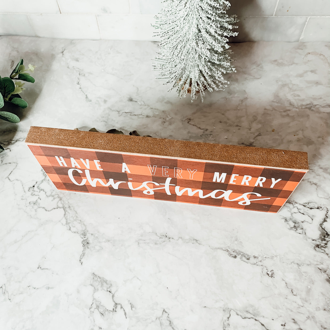 A festive Red Buffalo Christmas Sign made of thick wood, featuring a classic gingham pattern, perfect for holiday decor.