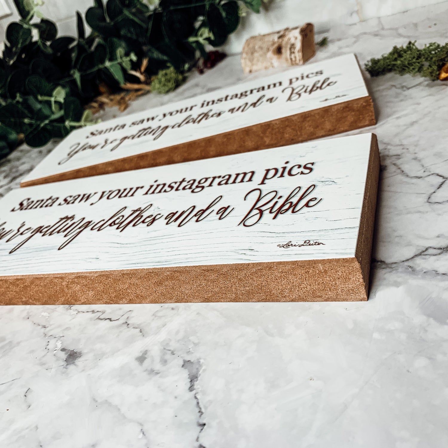 A humorous wooden sign reading 'Santa Seen Your Instagram & He’s Getting You Clothes & a Bible', perfect for holiday decor.