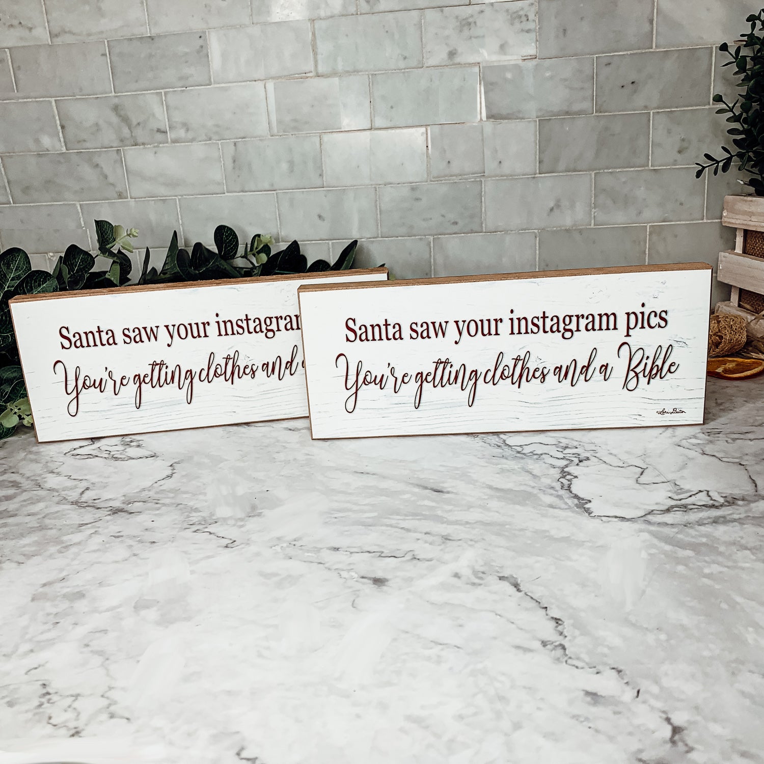 A humorous wooden sign reading 'Santa Seen Your Instagram & He’s Getting You Clothes & a Bible', perfect for holiday decor.