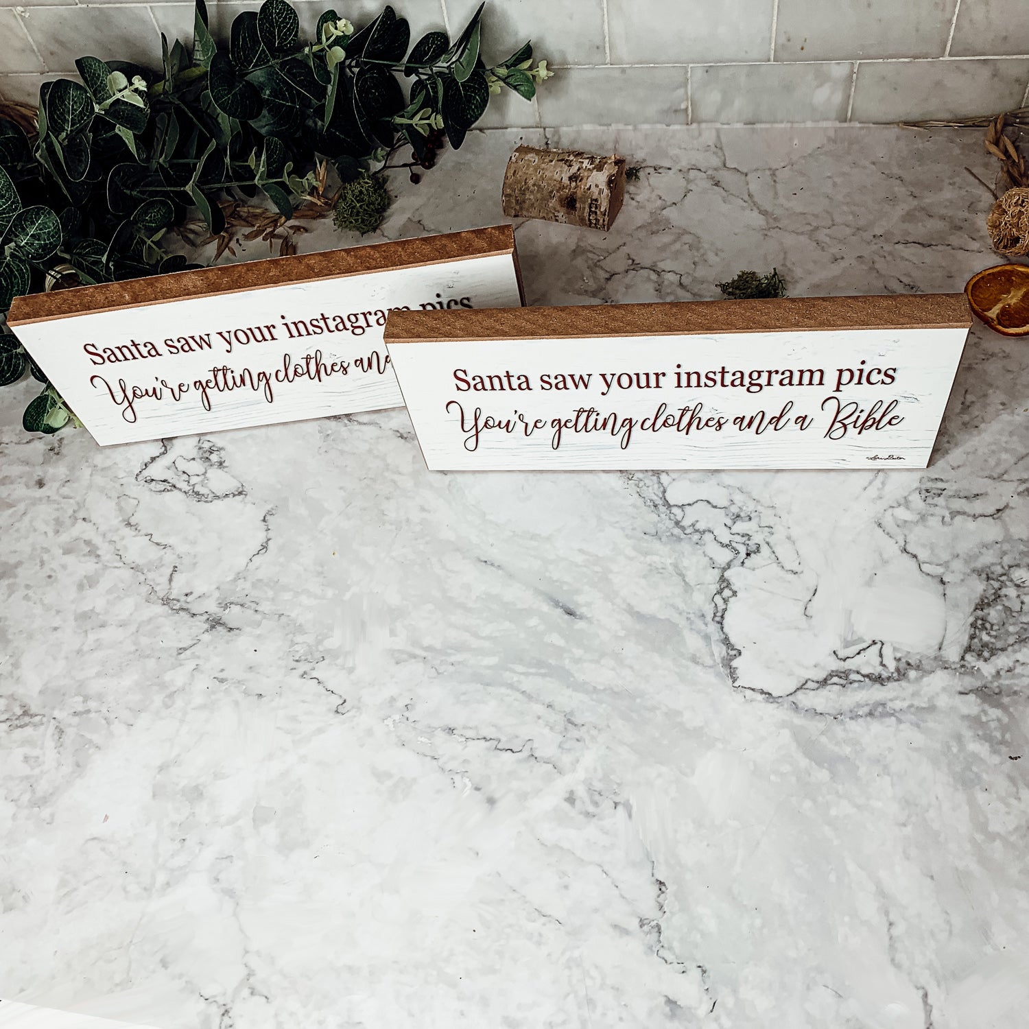 A humorous wooden sign reading 'Santa Seen Your Instagram & He’s Getting You Clothes & a Bible', perfect for holiday decor.