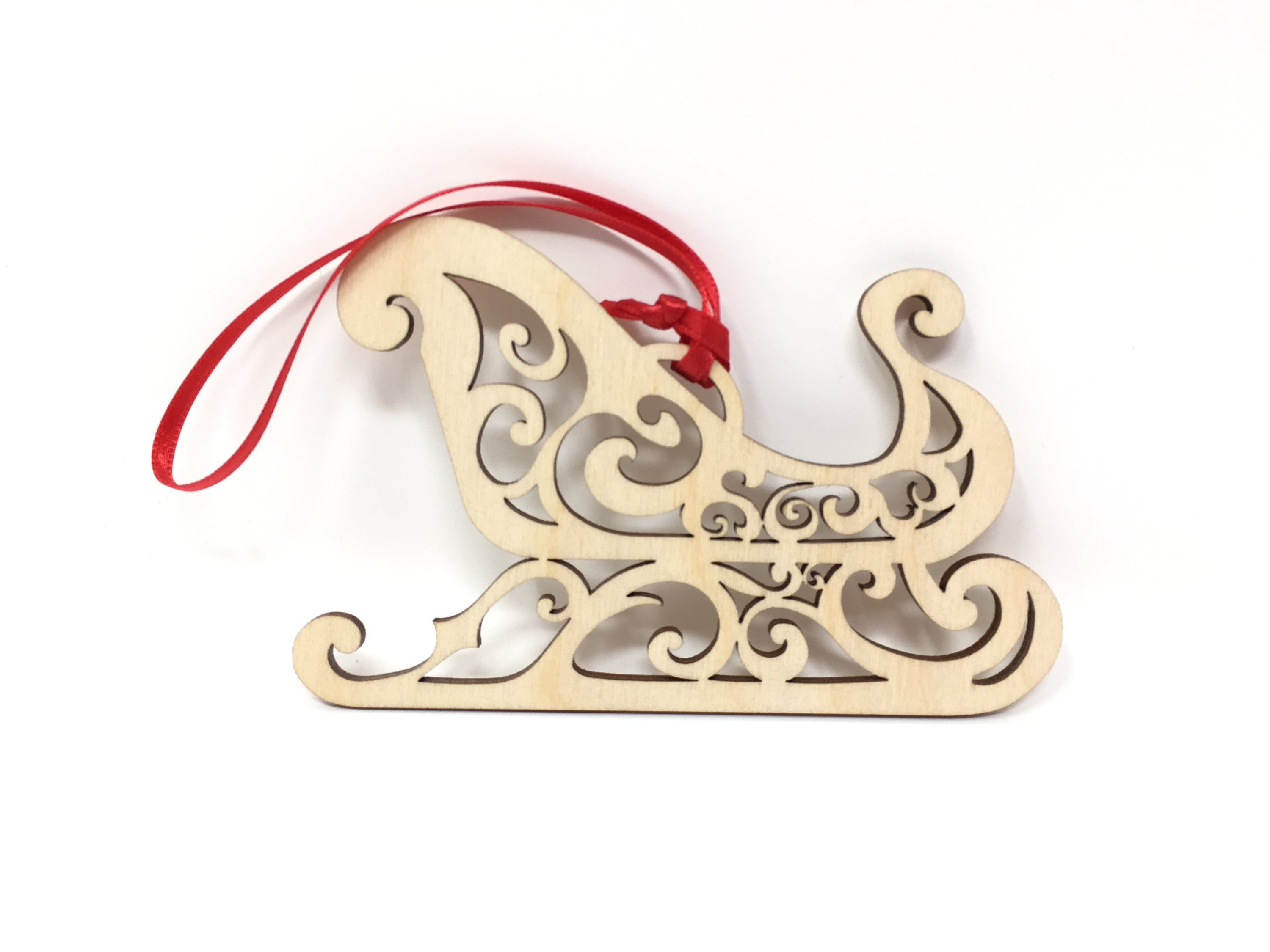 A beautifully crafted Santa's Sleigh ornament made from premium Baltic Birch wood, elegantly packaged in a jewelry box.