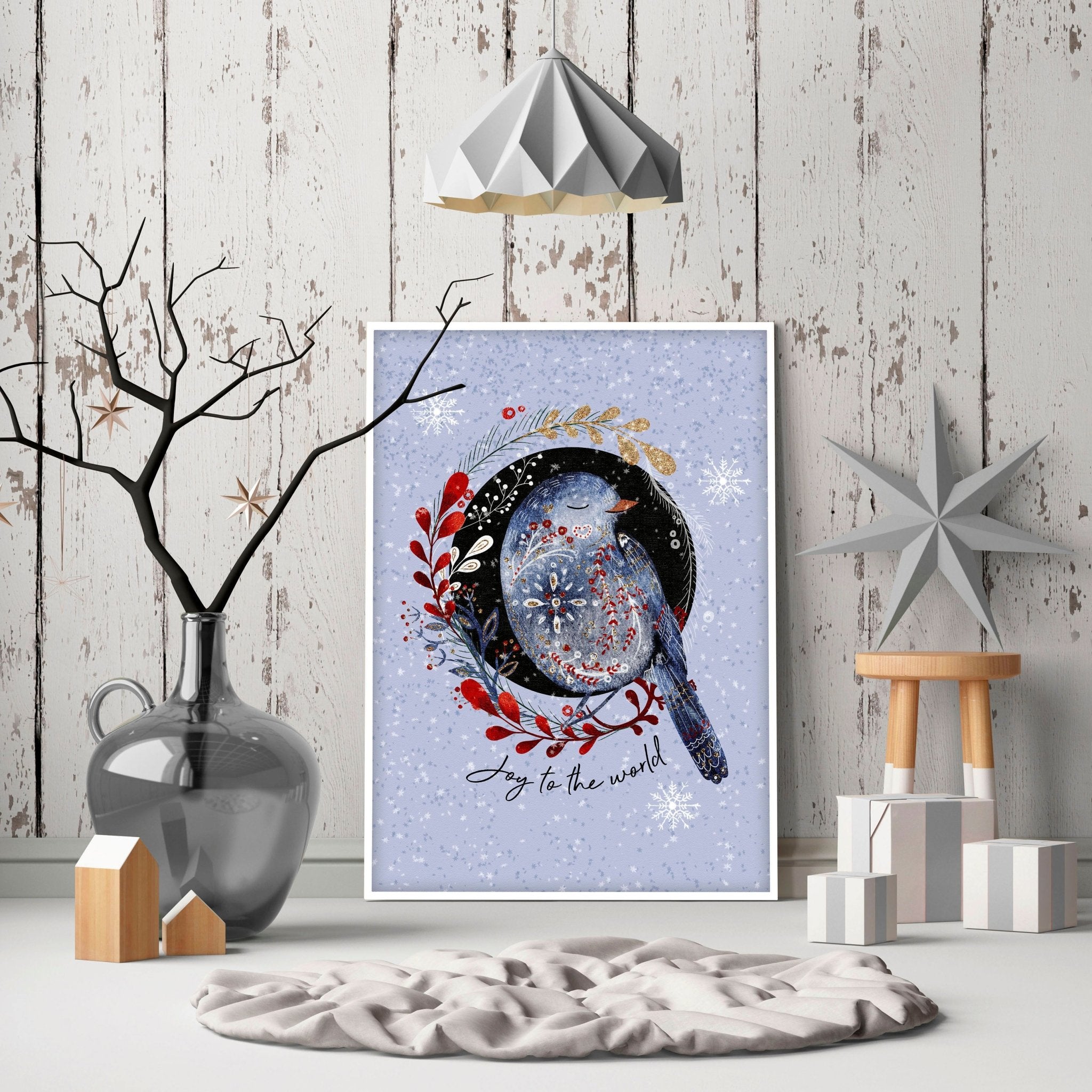 Scandi Christmas wall art print featuring a wreath with folk-style birds on a light blue snowed background.