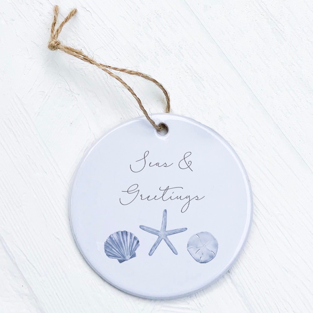 Seas & Greetings porcelain ornament featuring original designs, 2.75 inches in diameter, with a smooth glossy finish.