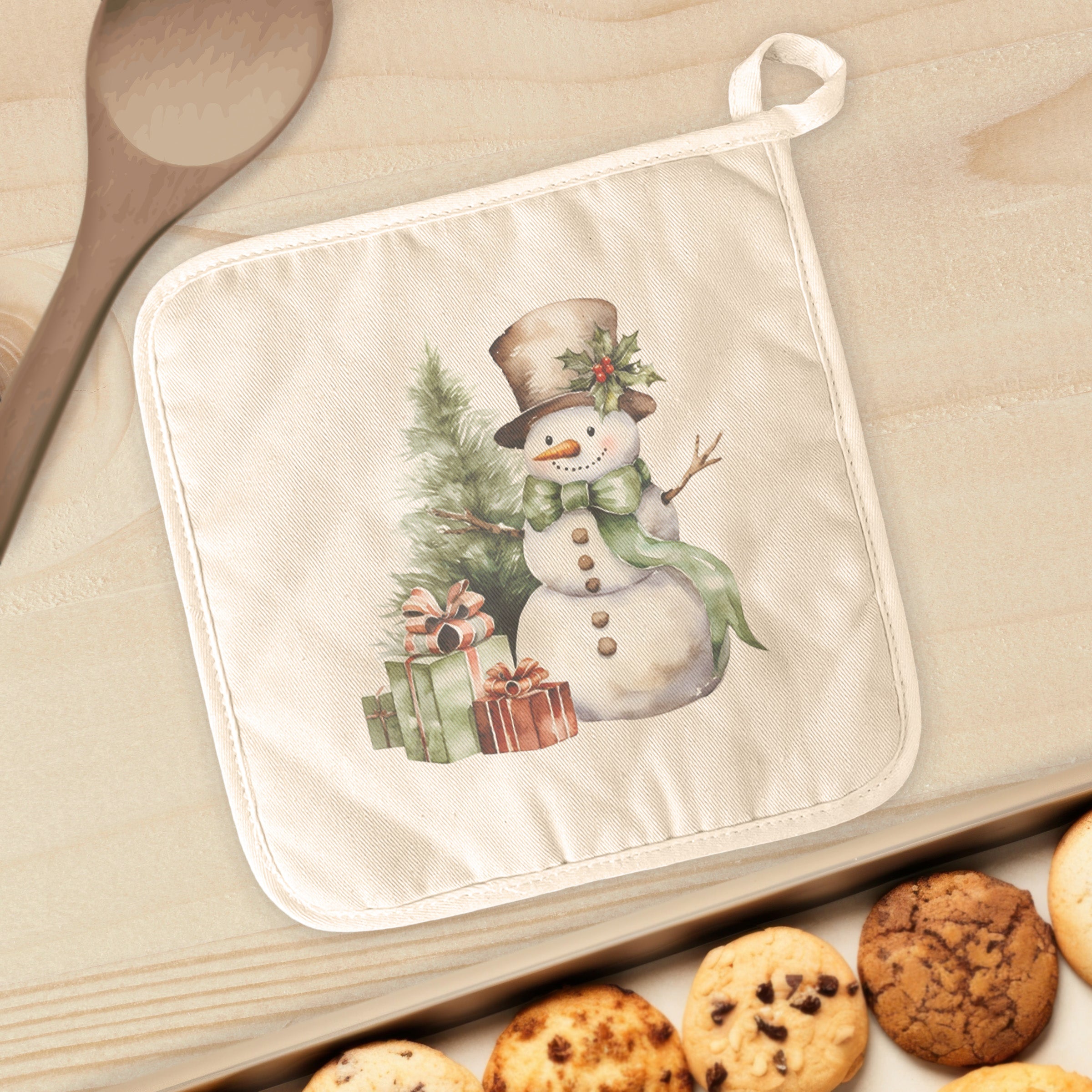 A festive cotton pot holder featuring a snowman and presents design, perfect for protecting surfaces from hot cookware.