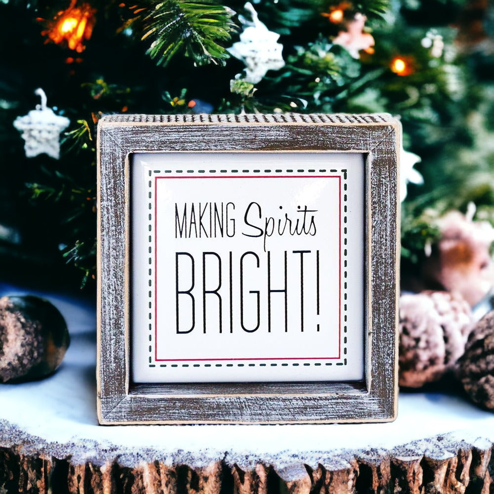 A 5-inch wooden framed sign with the text 'Making Spirits Bright' embossed in metal, featuring a festive red border.