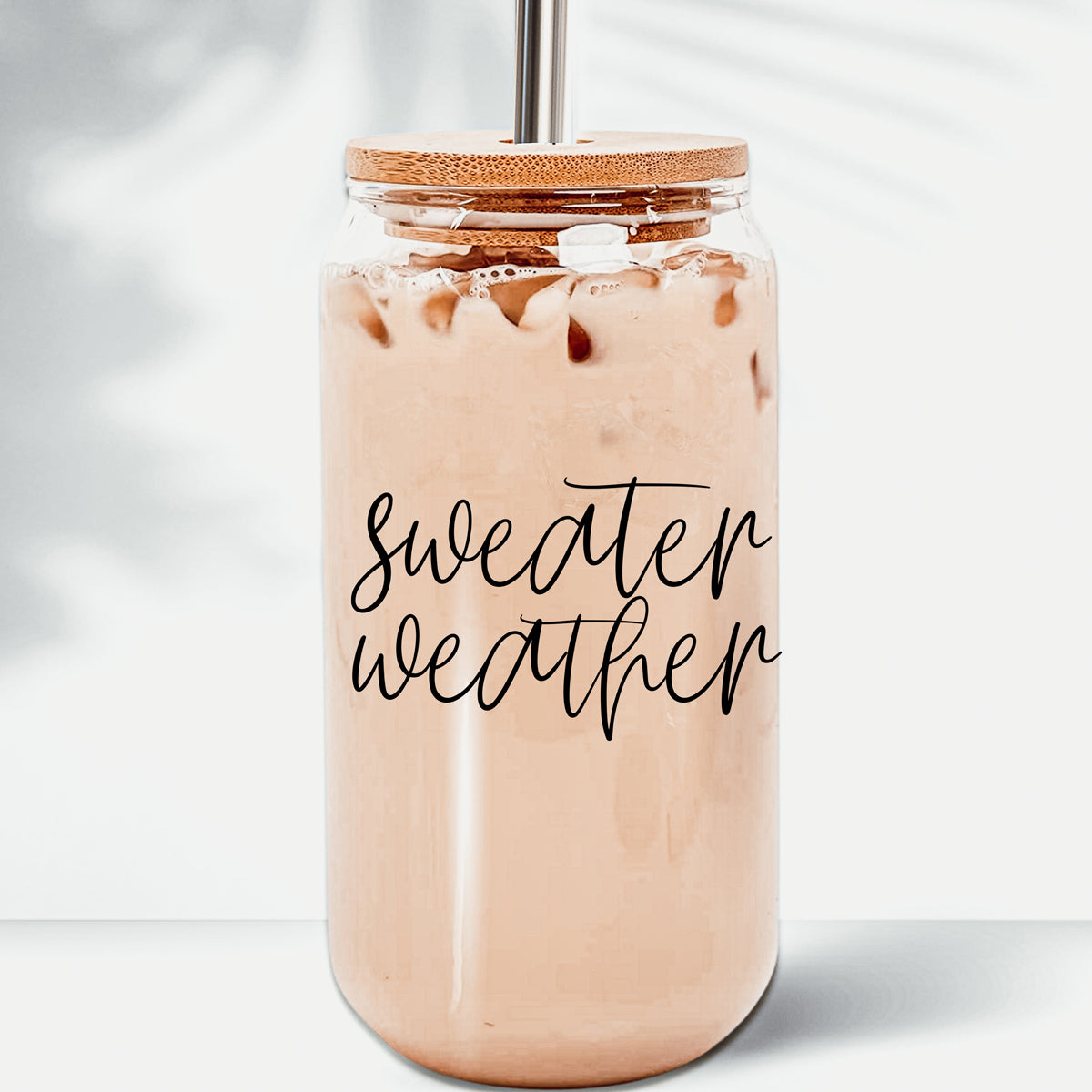 Sweater Weather Cup with bamboo lid and stainless steel straws, showcasing its elegant design and functionality.