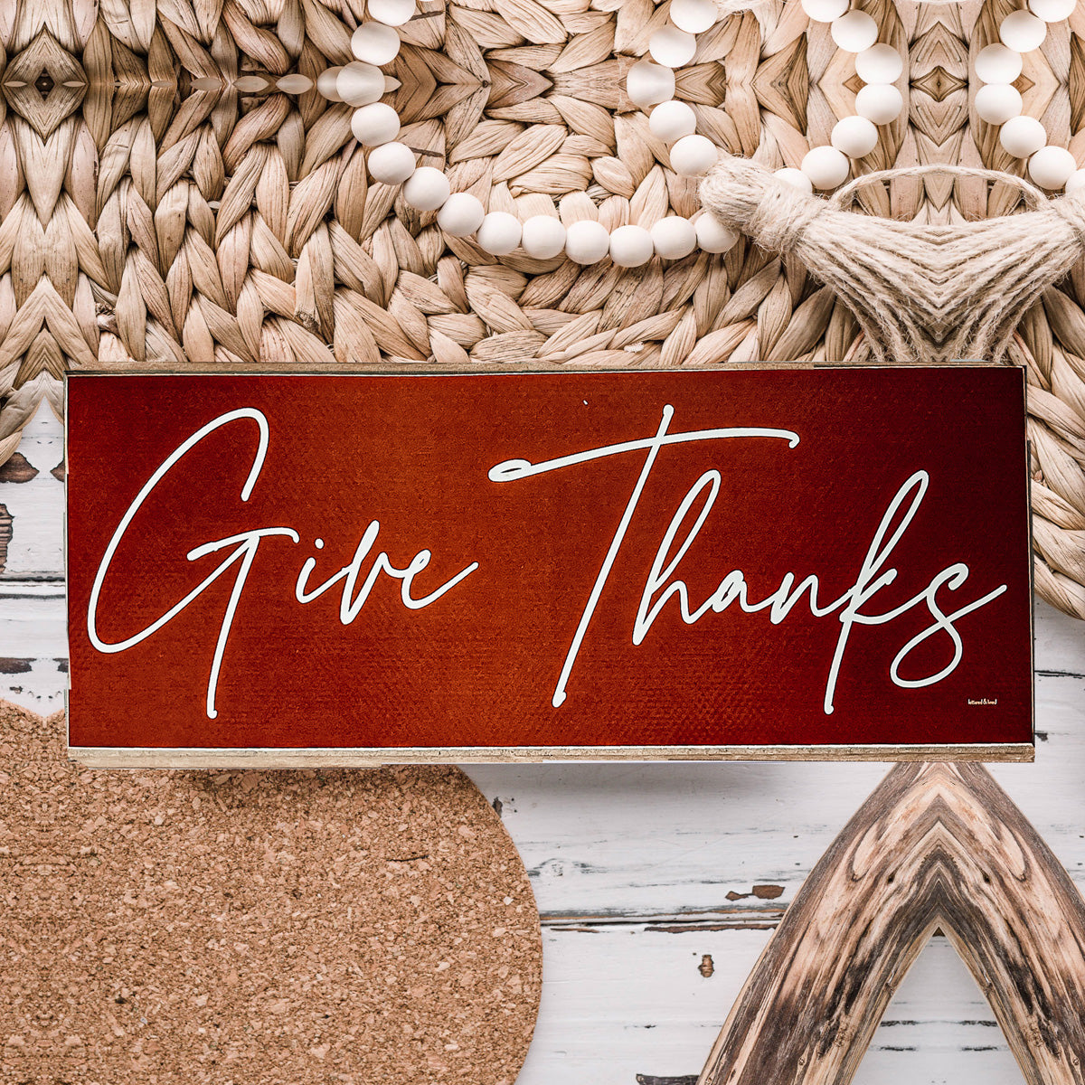 Two rustic wooden signs with 'Give Thanks' and 'Thankful' in elegant script, perfect for home decor.