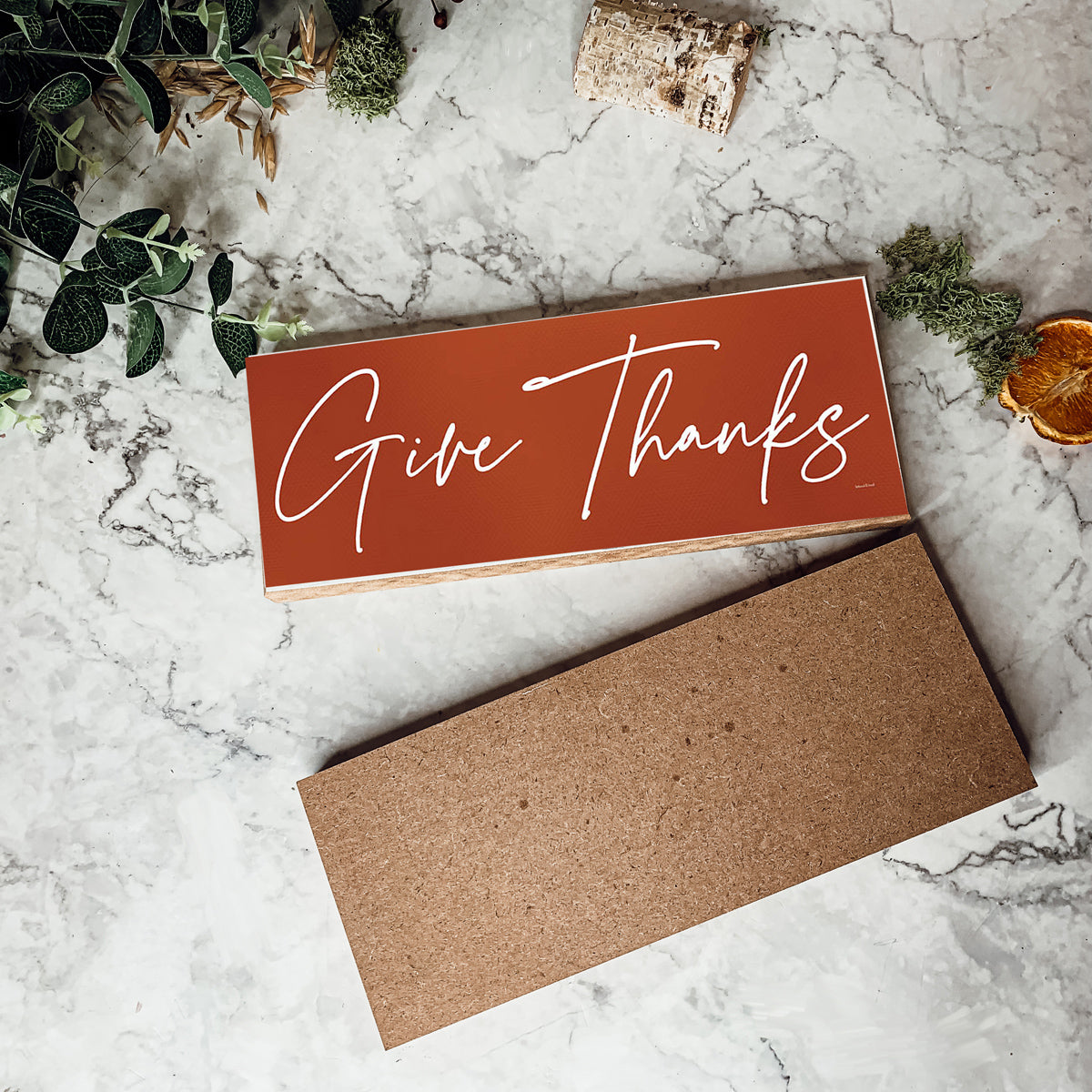 Two rustic wooden signs with 'Give Thanks' and 'Thankful' in elegant script, perfect for home decor.