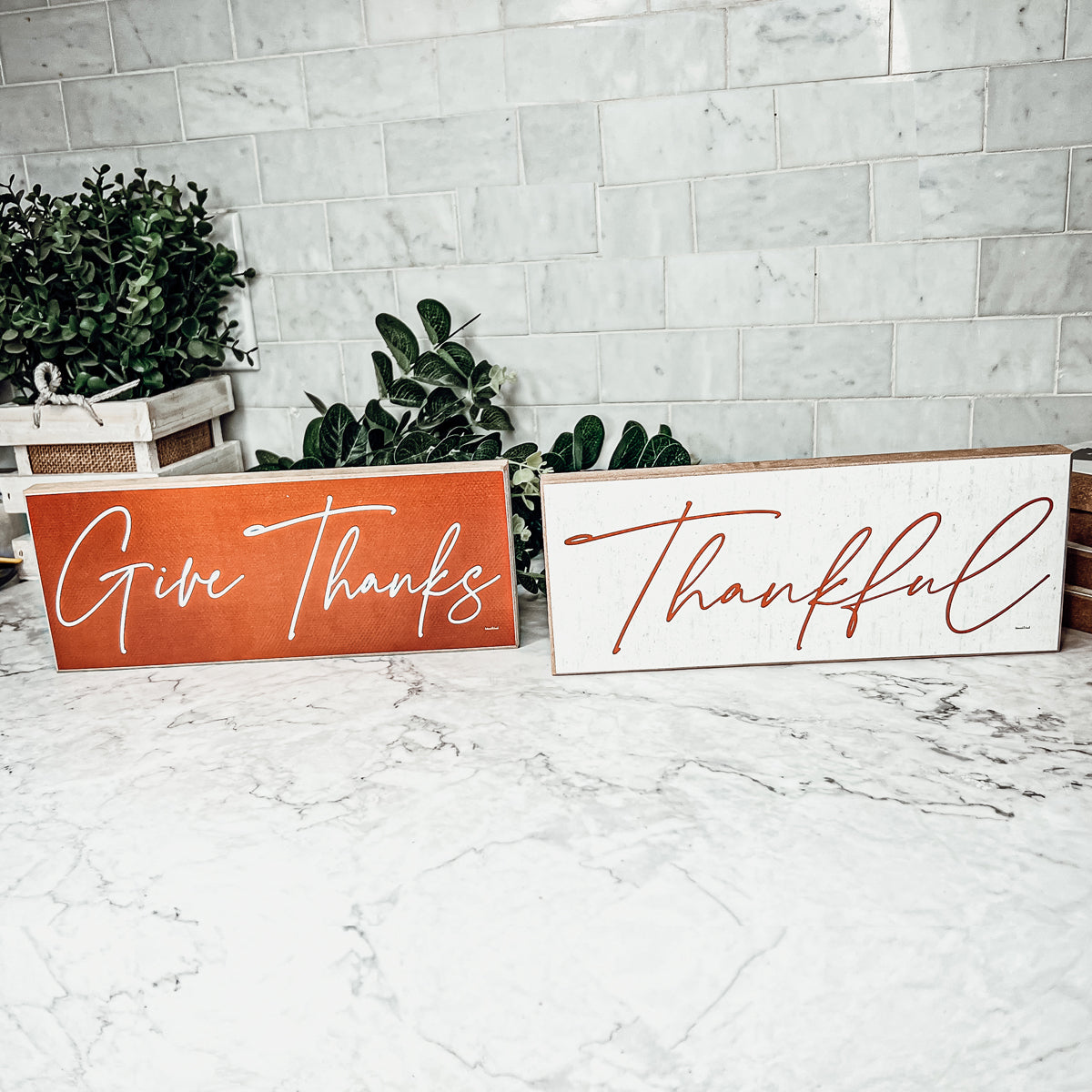 Two rustic wooden signs with 'Give Thanks' and 'Thankful' in elegant script, perfect for home decor.