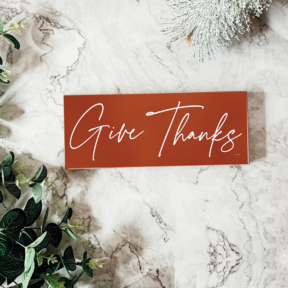 Two rustic wooden signs with 'Give Thanks' and 'Thankful' in elegant script, perfect for home decor.