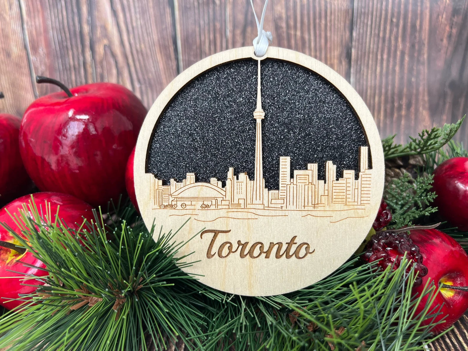 Toronto Skyline Ornament made from premium Baltic birch wood, showcasing the city's iconic skyline design.