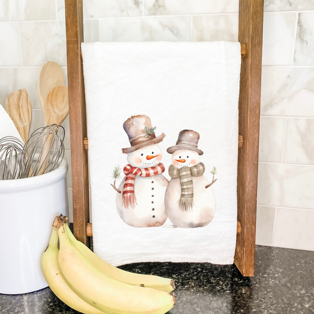 Two Snowmen cotton tea towel featuring a vibrant design with cheerful snowmen, perfect for holiday kitchen decor.