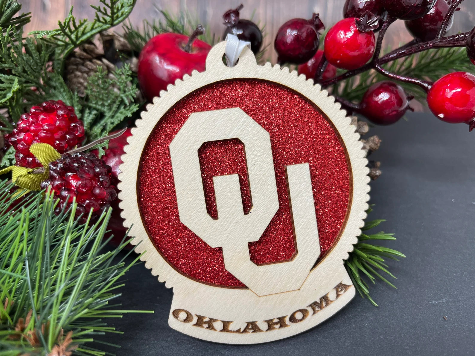 Handmade University of Oklahoma Ornament made from birch wood, measuring 4 inches by 4 inches, elegantly packaged in a cotton-filled box.