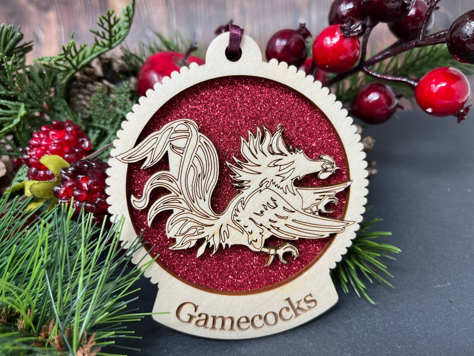 Custom wooden ornament featuring the University of South Carolina Gamecock logo, handcrafted from sustainable birch wood.