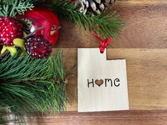 A beautifully crafted wooden ornament shaped like the state of Utah, made from premium Baltic Birch wood, showcasing intricate details.