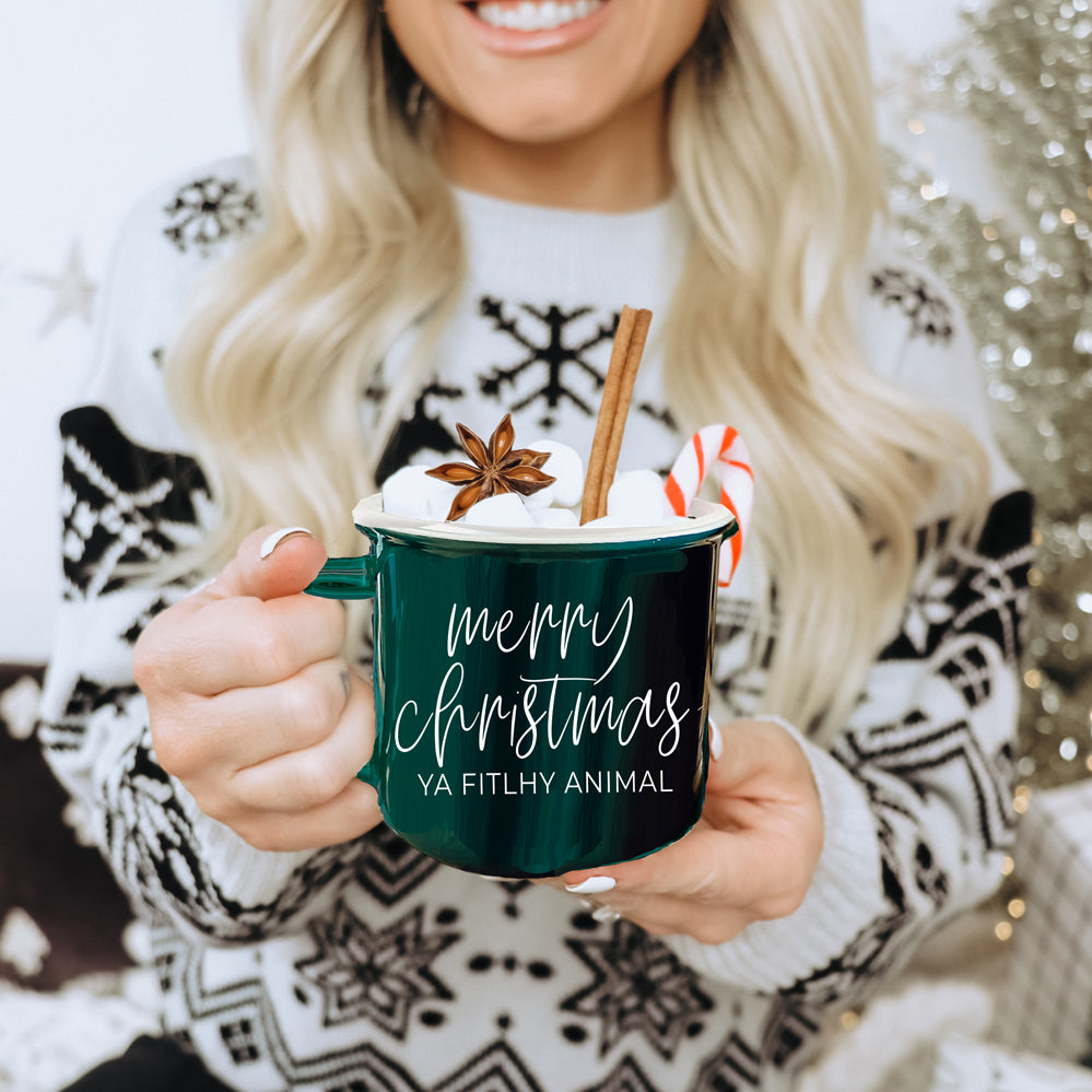 A quirky ceramic mug featuring the phrase 'Ya Filthy Animal' with the word 'Filthy' humorously misspelled as 'Fitlhy', available in red or green.