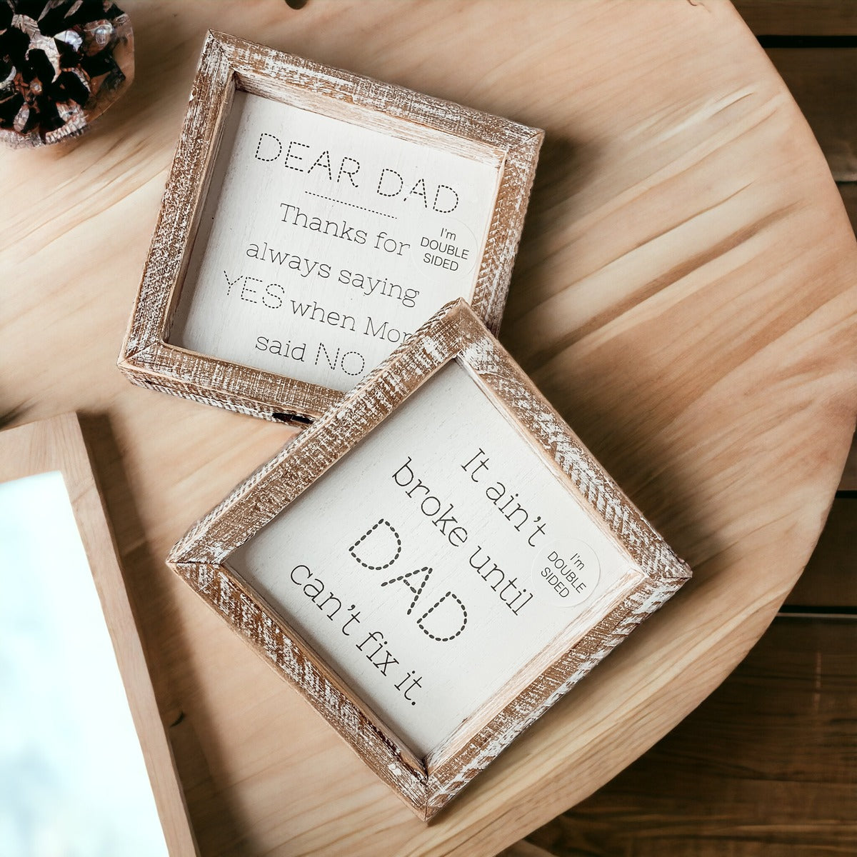 Double-sided wooden sign featuring humorous and heartfelt messages for dads, framed in rustic white wash.