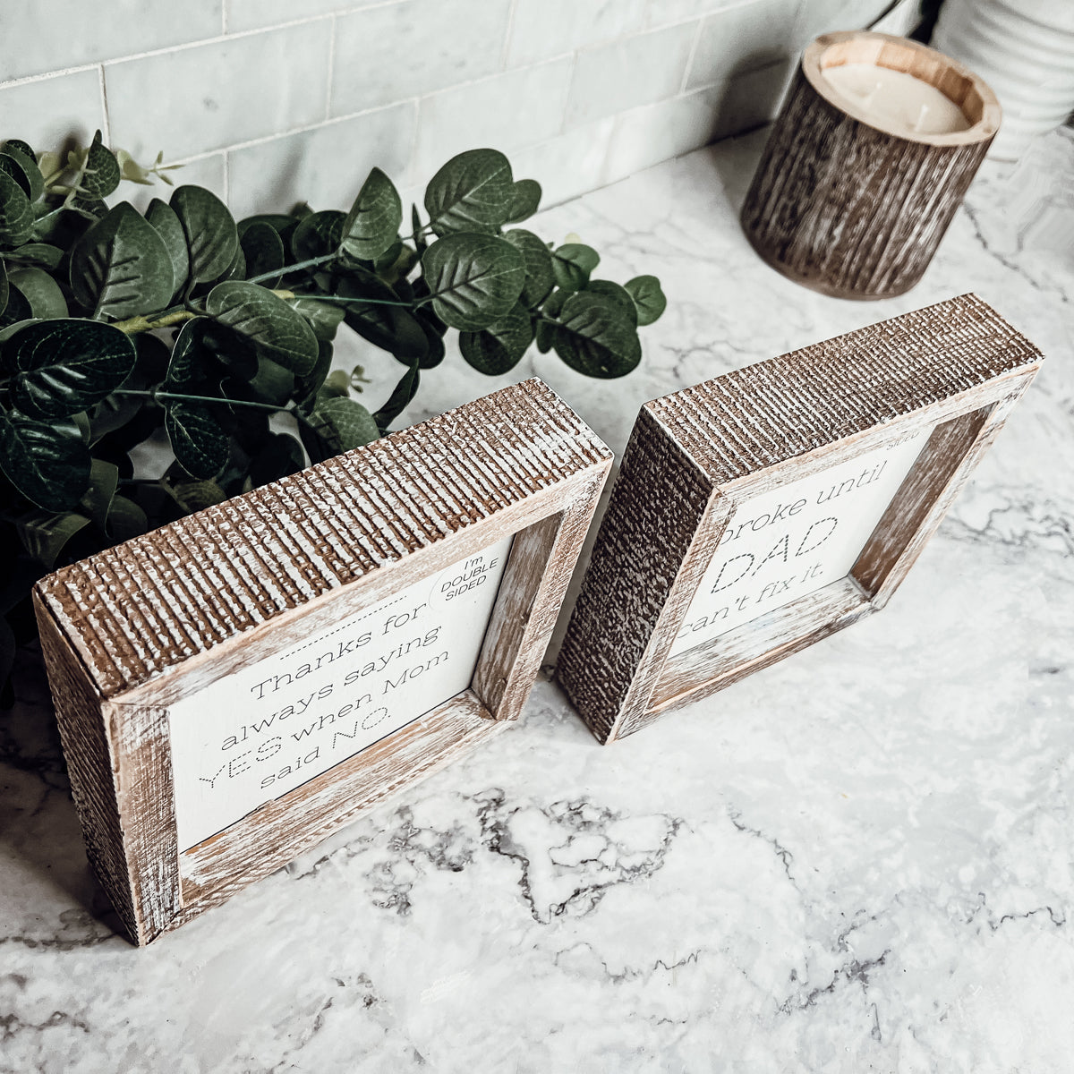 Double-sided wooden sign featuring humorous and heartfelt messages for dads, framed in rustic white wash.