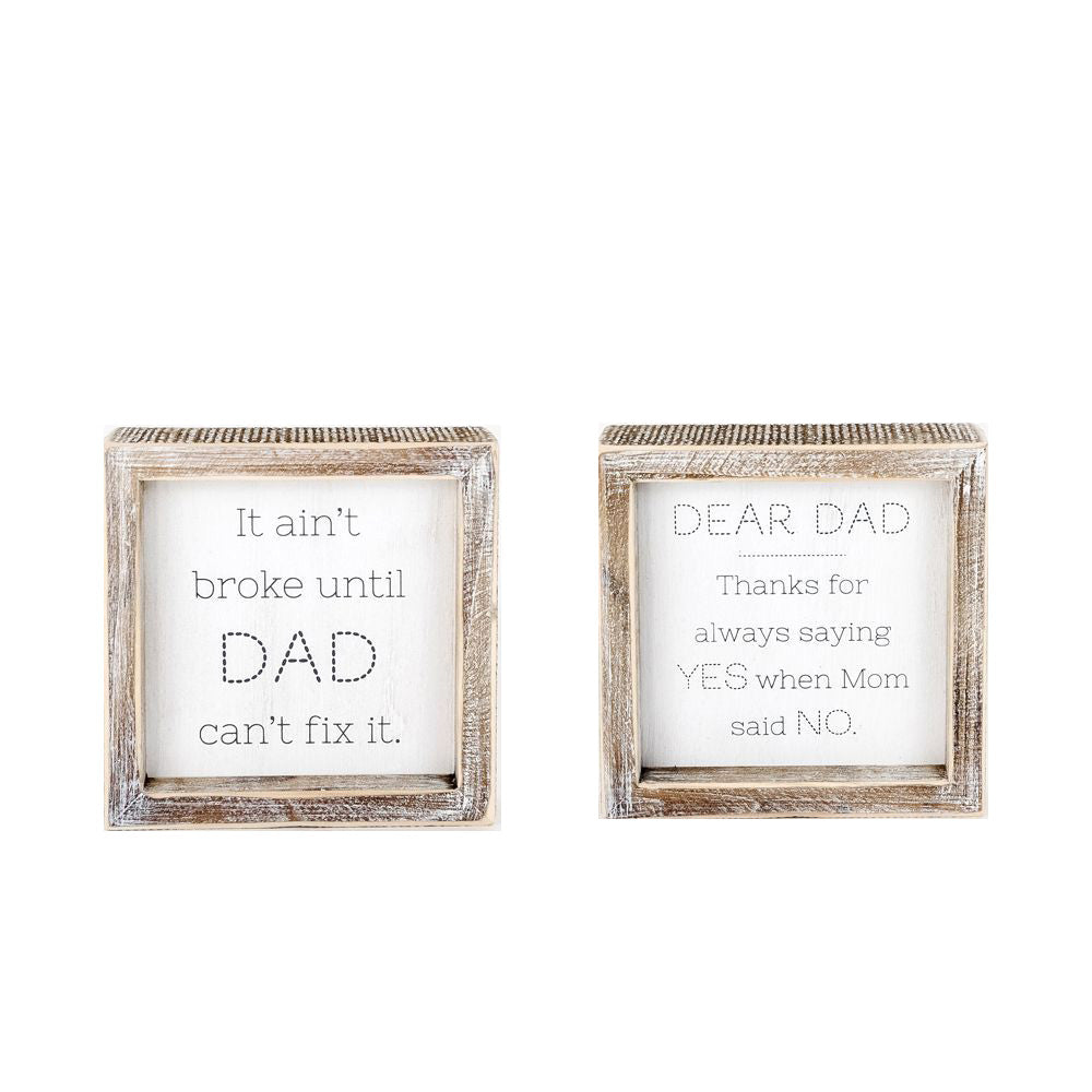 Double-sided wooden sign featuring humorous and heartfelt messages for dads, framed in rustic white wash.