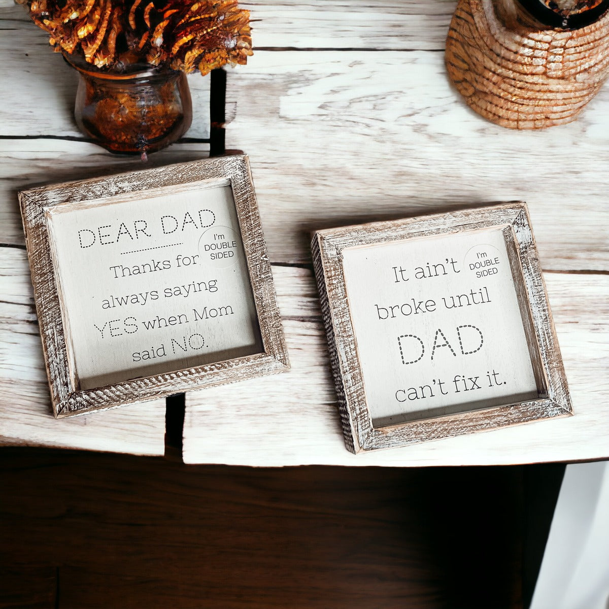 Double-sided wooden sign featuring humorous and heartfelt messages for dads, framed in rustic white wash.