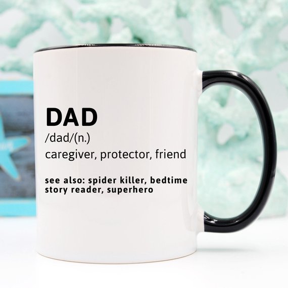 Funny coffee mug with the phrase 'DAD (n.) caregiver, protector, friend, see also: spider killer, bedtime story reader, superhero' printed on it.