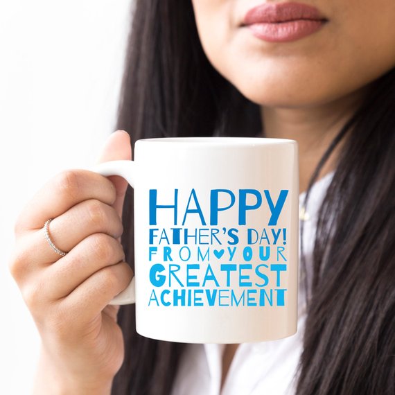 A white ceramic mug featuring a funny design, perfect for Father's Day gifts, showcasing vibrant colors and printed on both sides.